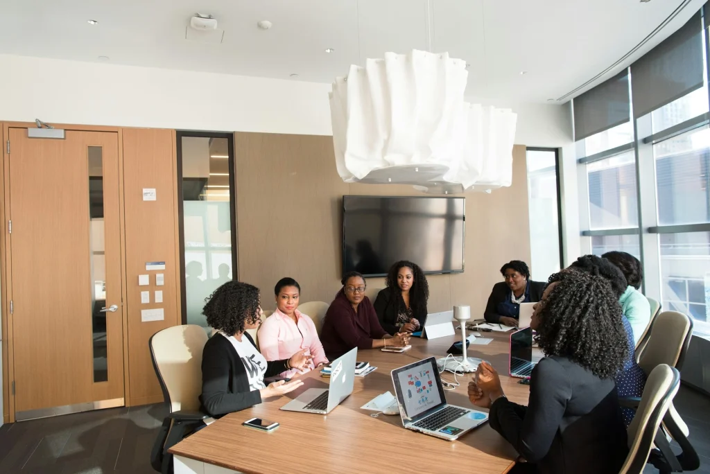 A group of women in a business meeting. Matching grants
