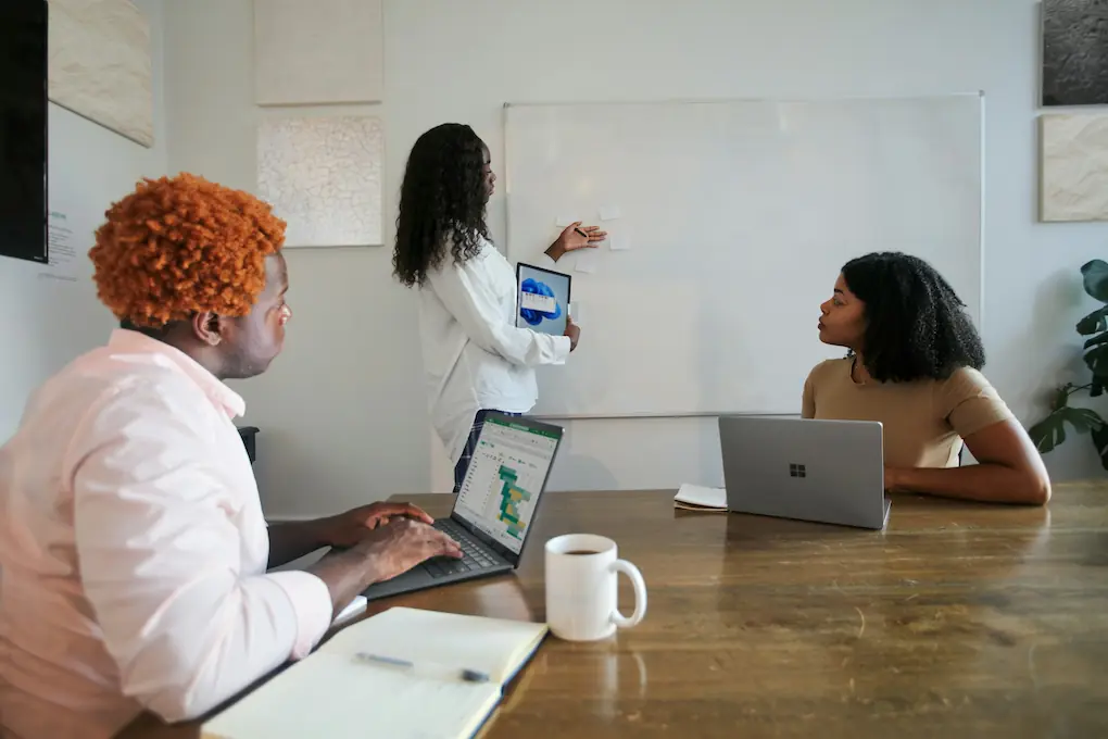 Three people working together